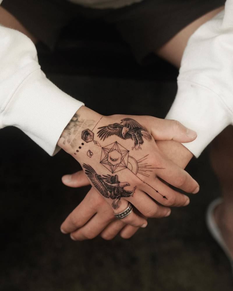 Eagle hand composition tattoo.