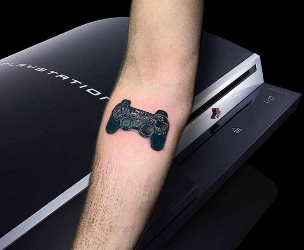 Micro-realistic Playstation controller located on the inner forearm.