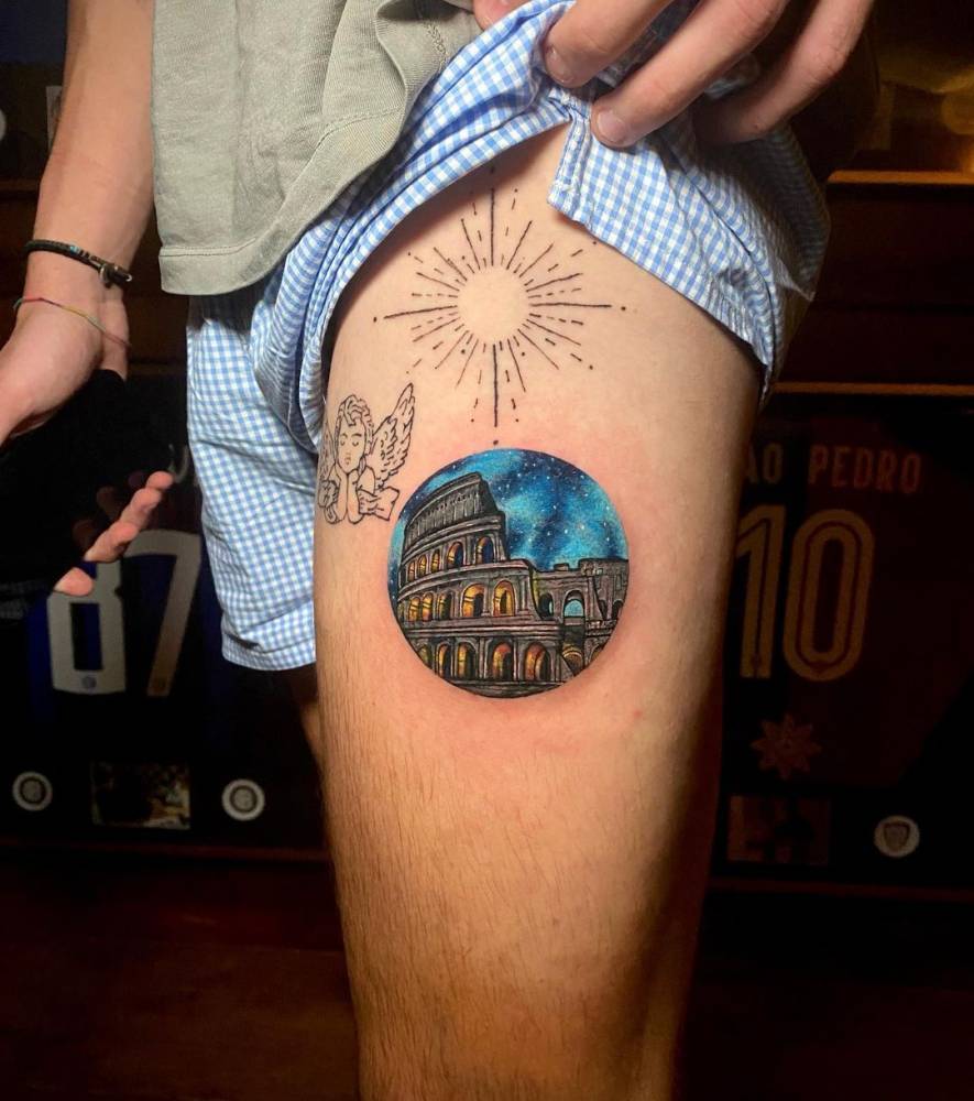 Micro-realistic style Colosseum tattoo done on the thigh.