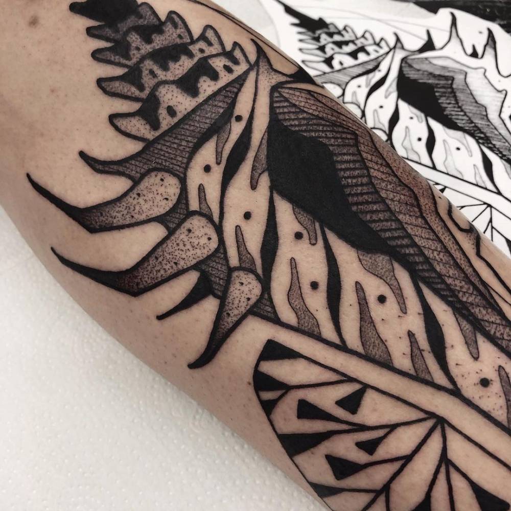 Blackwork Bolinus Brandaris tattoo on the inner forearm.