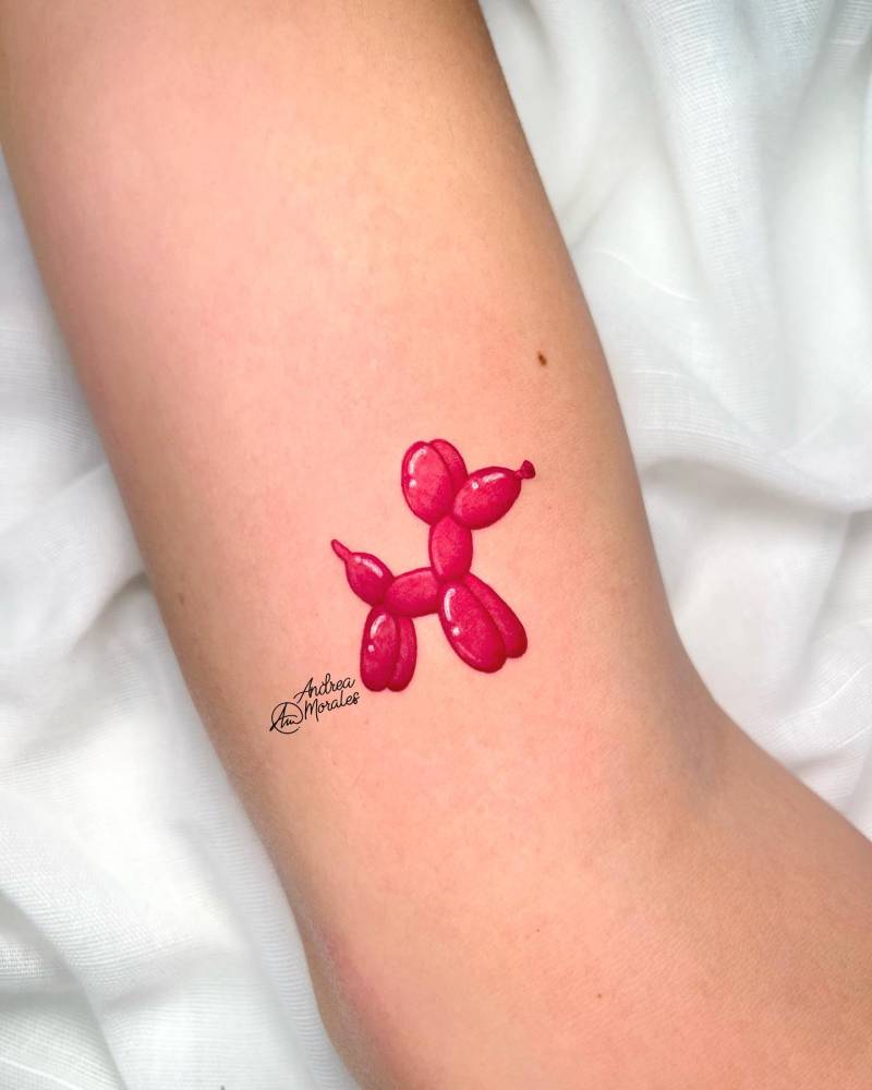 Balloon Dog tattoo located on the inner arm, micro-realistic style.