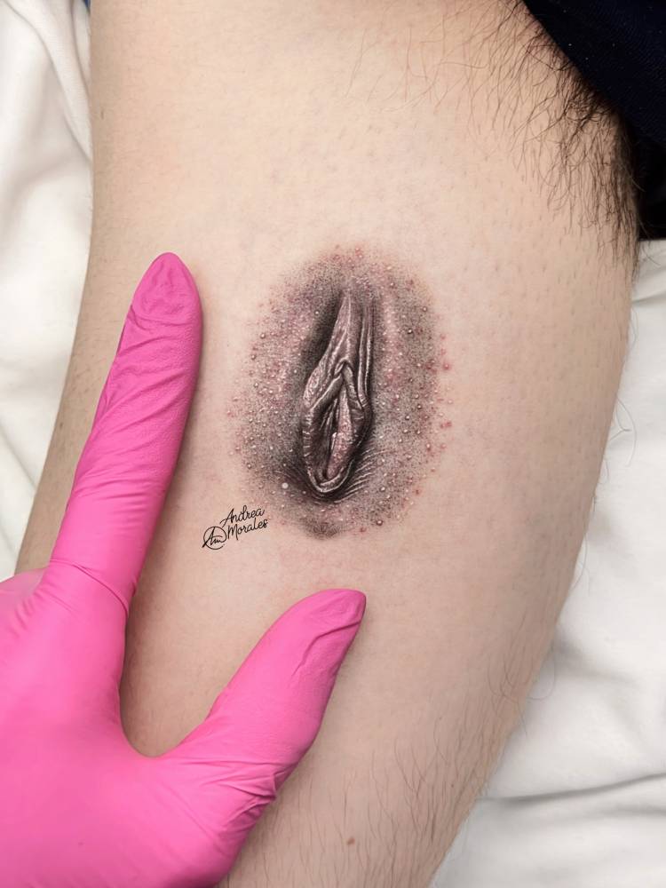 Vagina tattoo located on the inner arm, micro-realistic style.