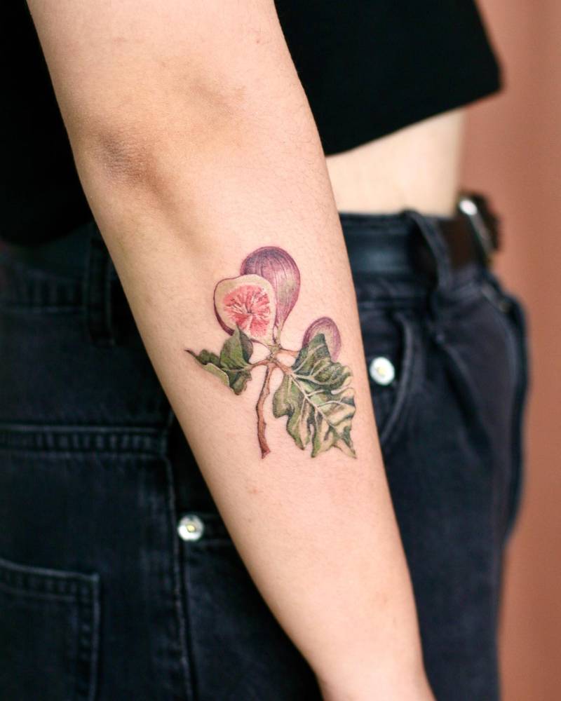 Watercolor style fig tattoo done on the forearm.