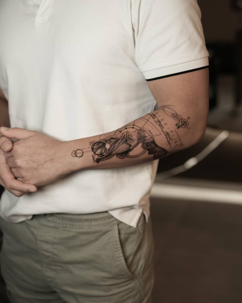 Graphic style Nike of Samothrace tattoo located on the forearm.