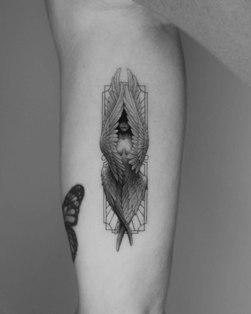 Seraphim tattoo in micro-realistic style done on the inner arm.