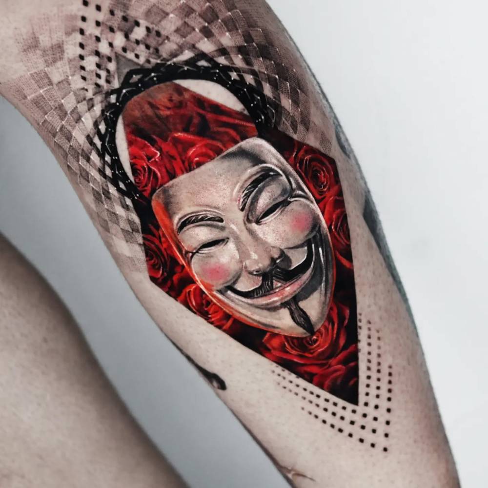 V for Vendetta tattoo located on the shin, done in micro-realism.