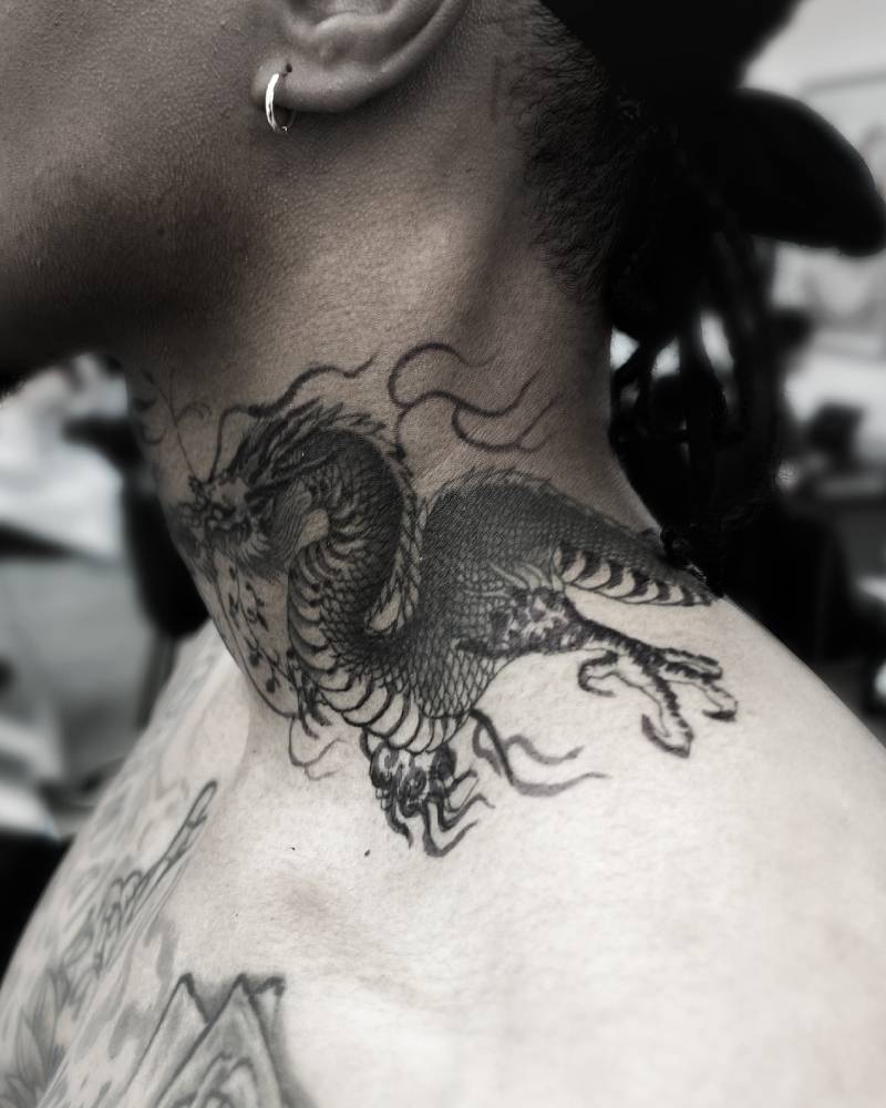 Oriental style dragon tattoo located on the neck.
