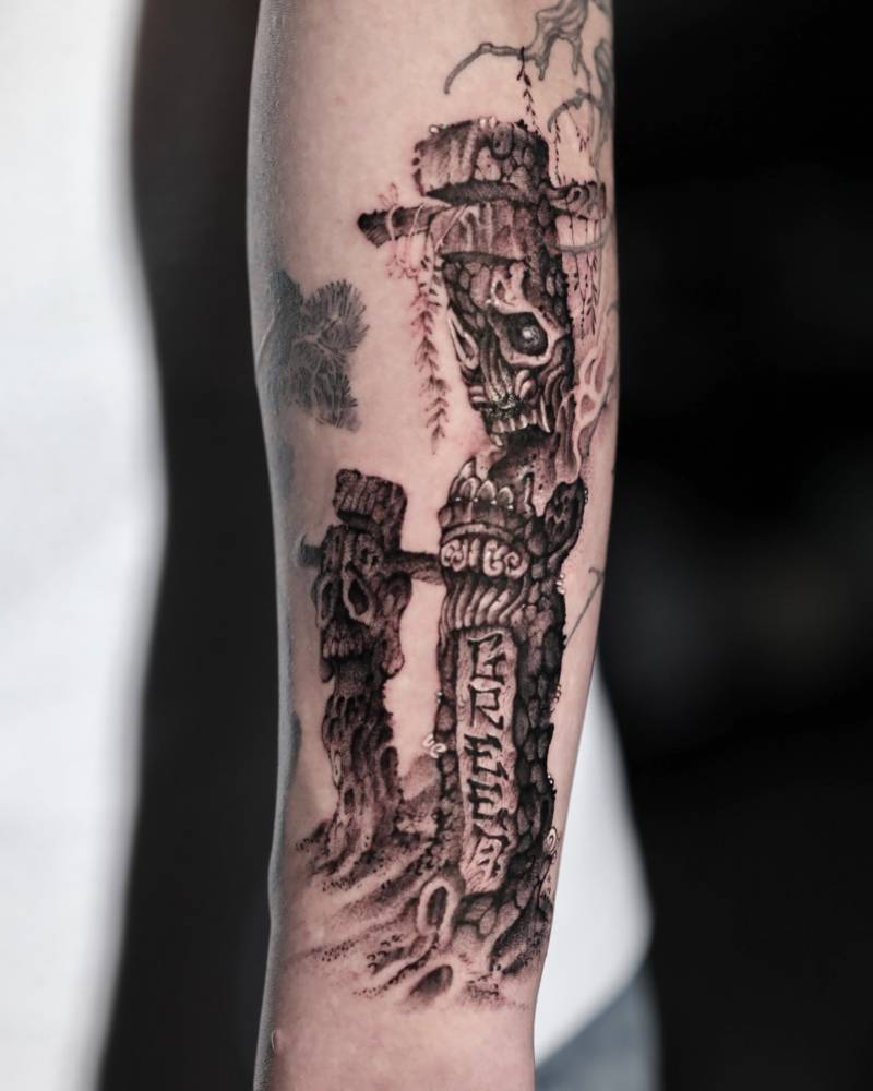 Totem tattoo in illustrative style located on the forearm.