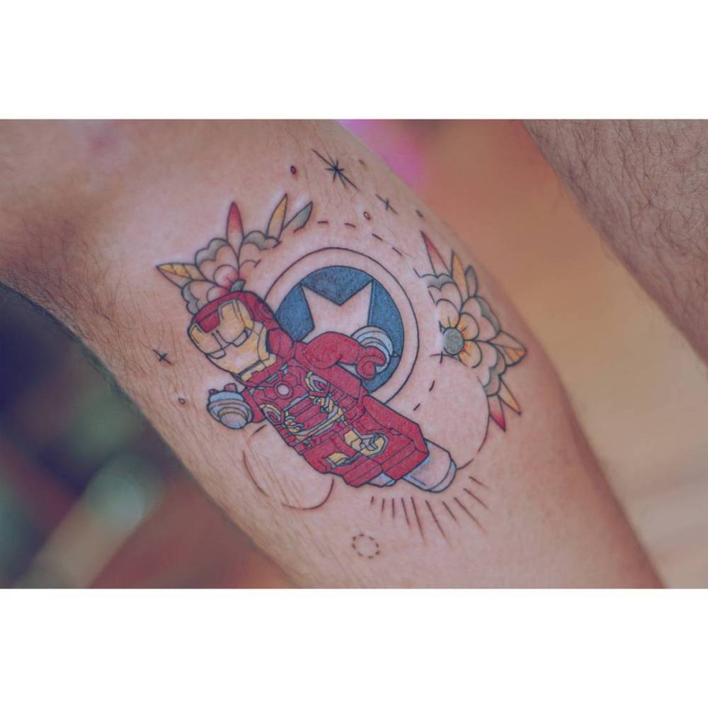 Iron Man lego minifigure tattooed on the shin, cartoon style.