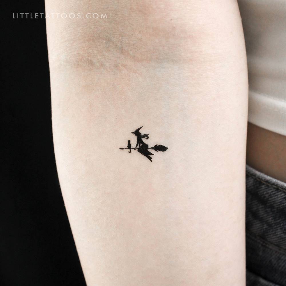 Flying witch temporary tattoo in minimalistic style located on the inner forearm.