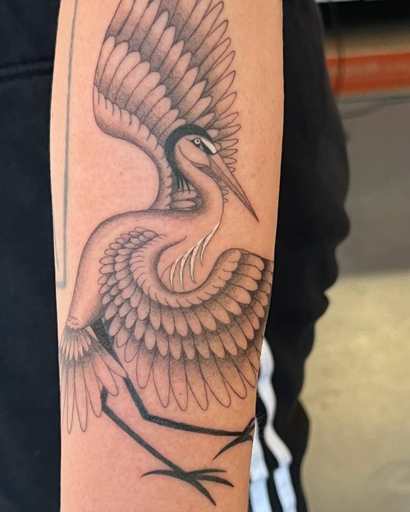 Heron tattoo in traditional style placed on the forearm.