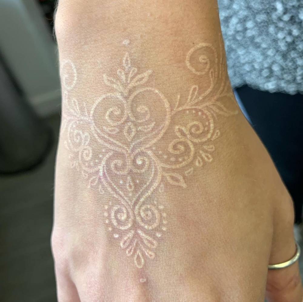 White ink Henna tattoo on the hand (healed).