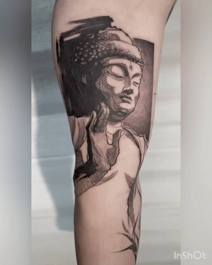 Buddha portrait tattoo done on the inner arm.