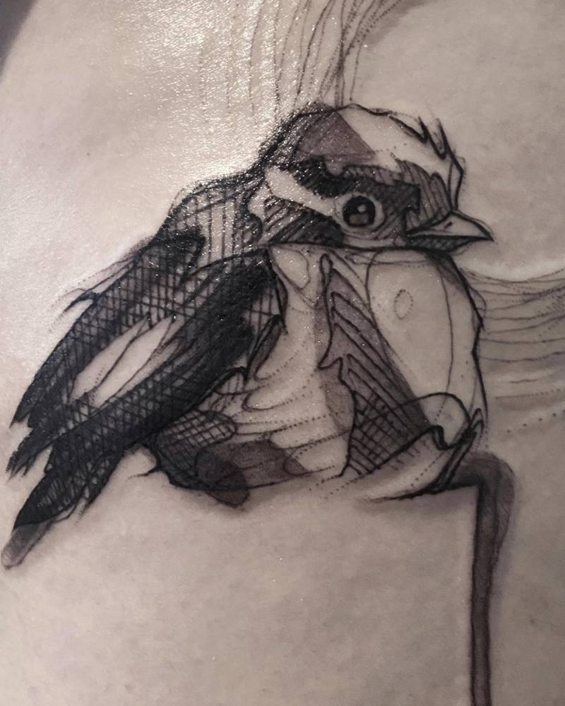 Sketch work sparrow tattoo located on the thigh.