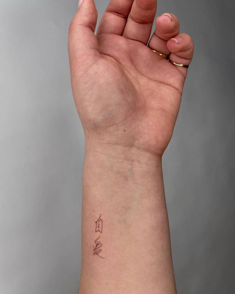 "Self love" in her mom's handwriting tattooed on the wrist.