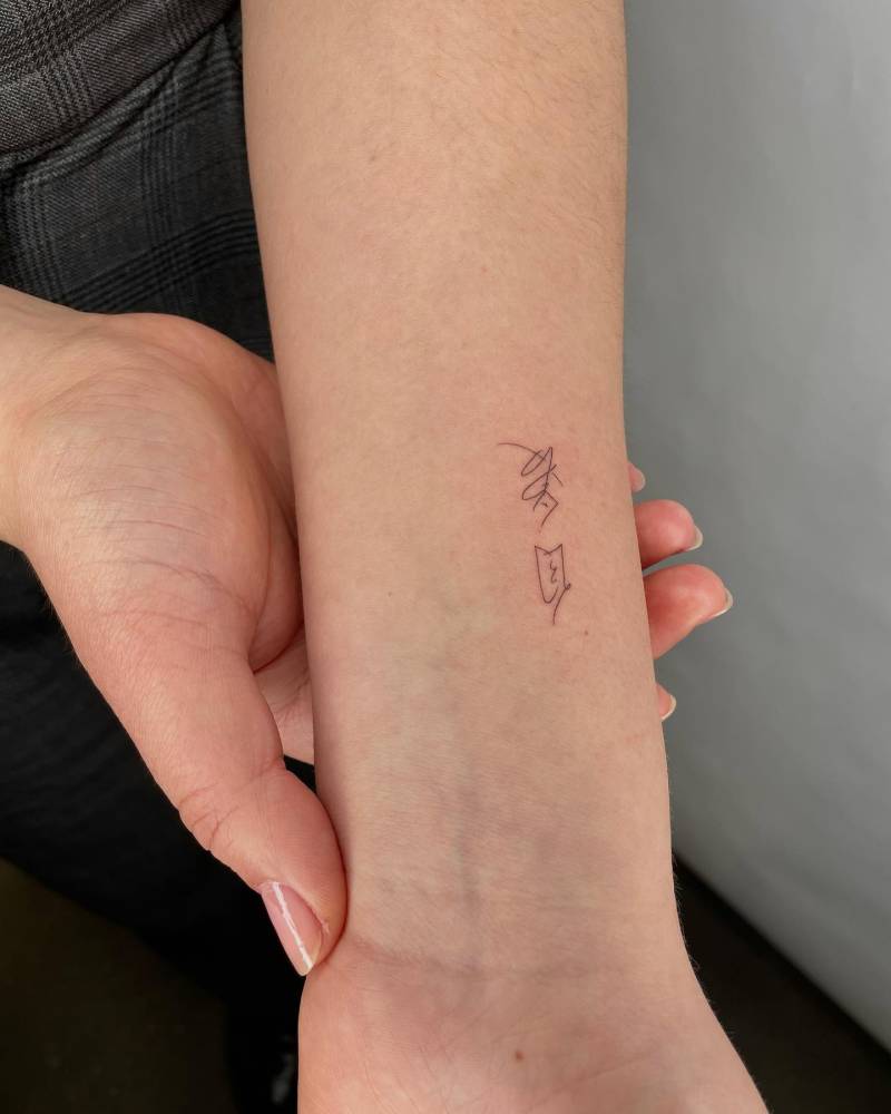 "Self love" in her mom's handwriting tattooed on the wrist.