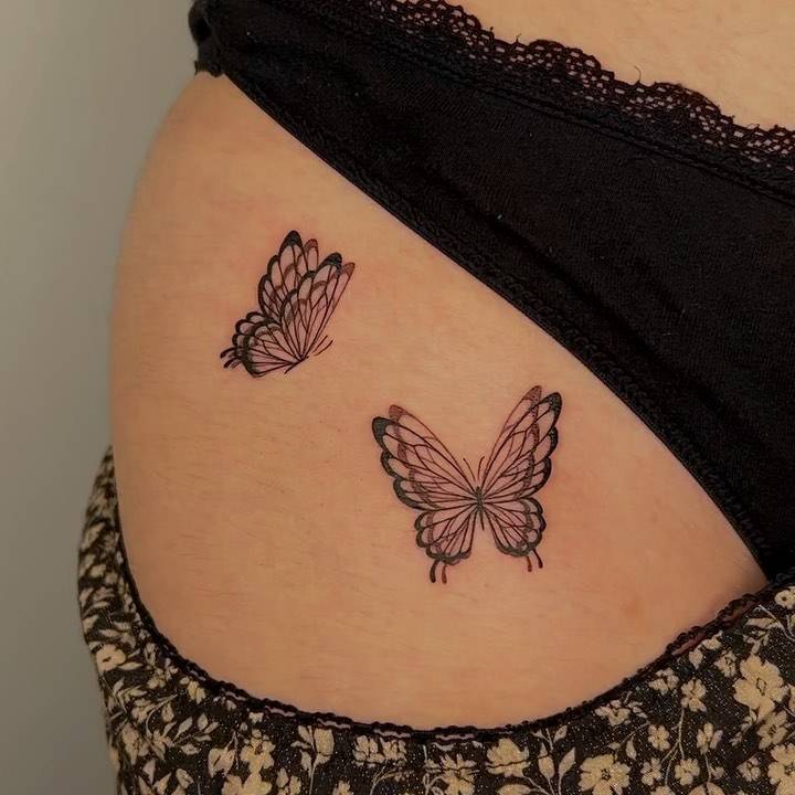 Butterfly couple tattoo located on the pelvis.