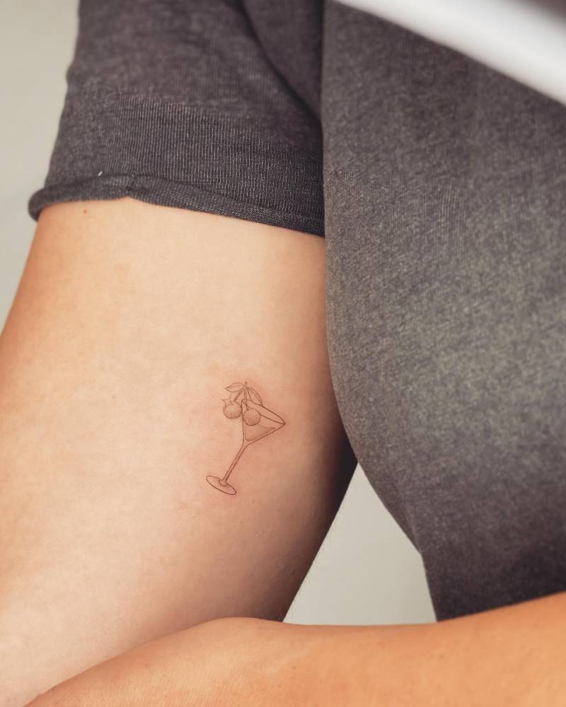 Cherry Martini tattoo located on the inner forearm.