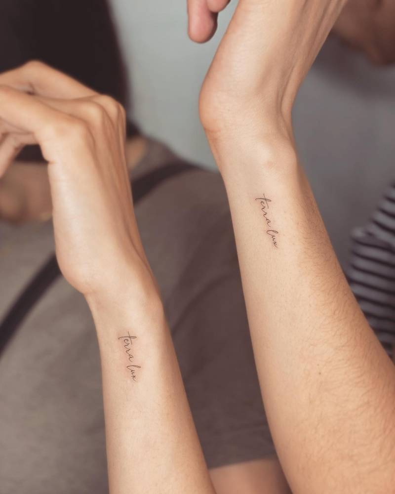 "Terra lux" matching lettering tattoo for mother and daughter.