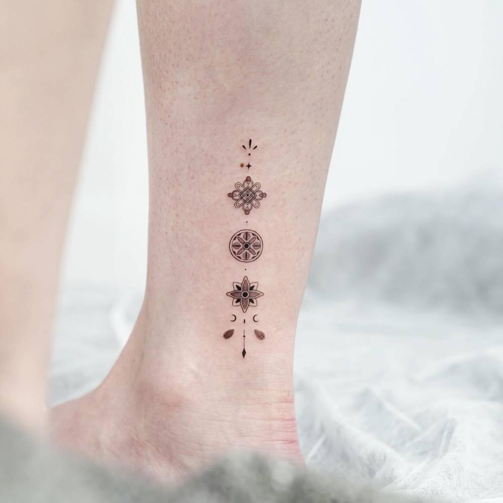 Dancheong tattoo located on the ankle, illustrative style.