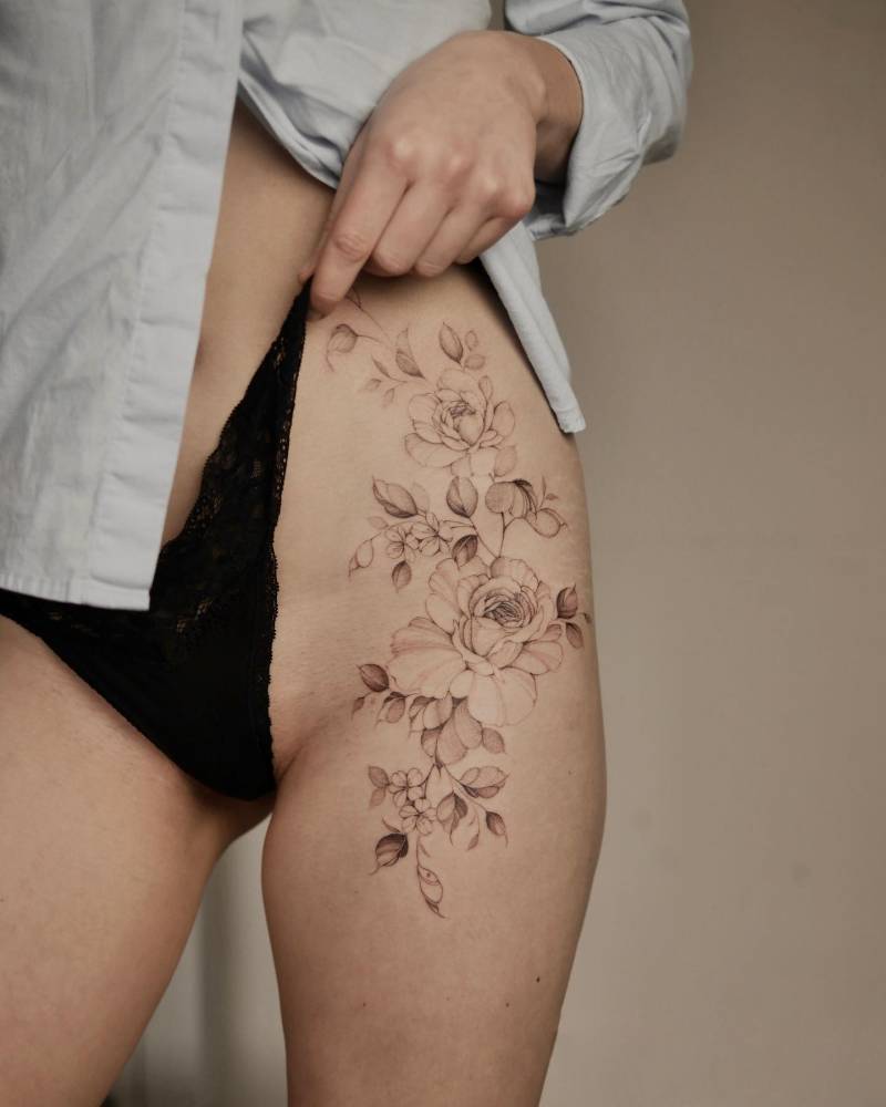 Illustrative style roses tattoo located on the hip.