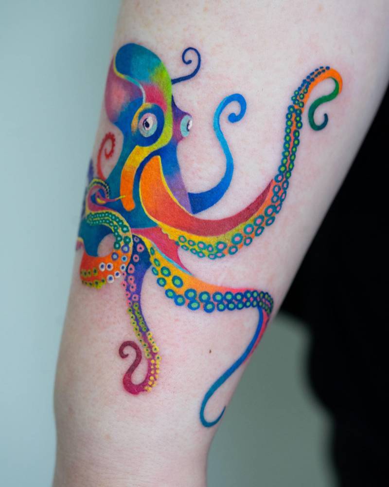 Colorful octopus tattoo placed on the forearm.