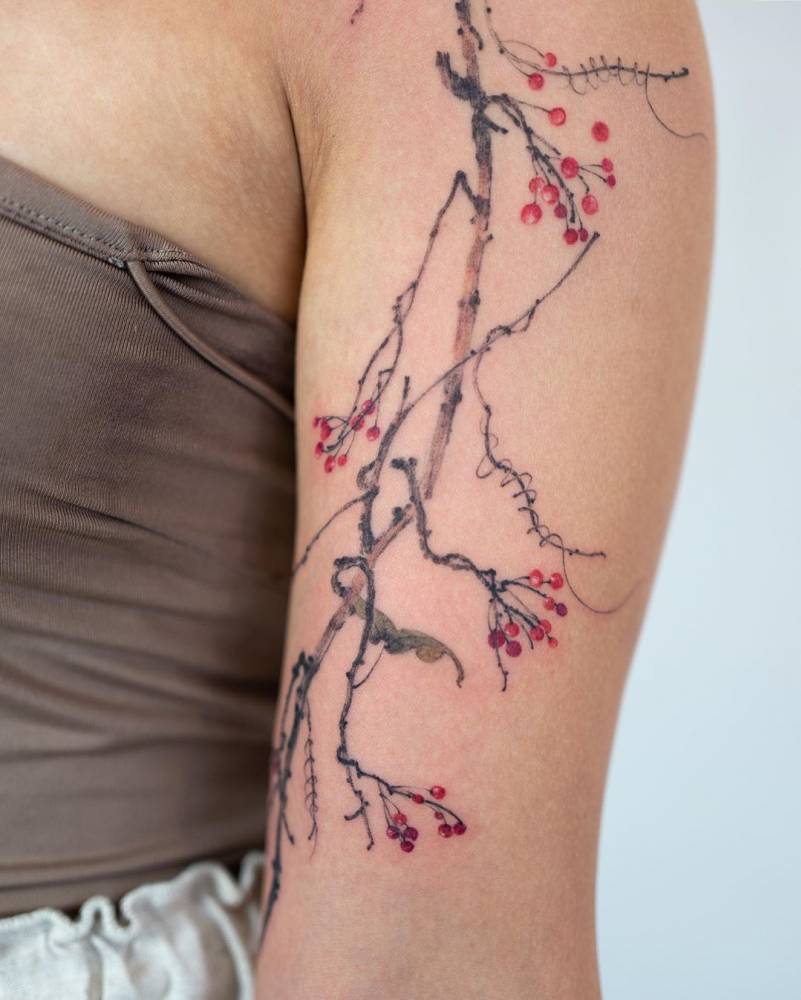 Watercolor Branch Tattoo on Upper Arm