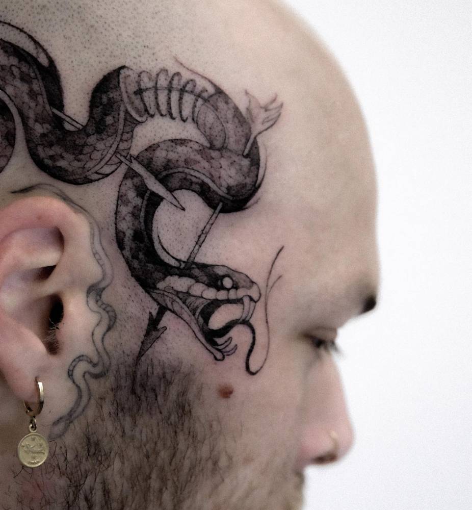 Snake tattoo located on the head, illustrative style.