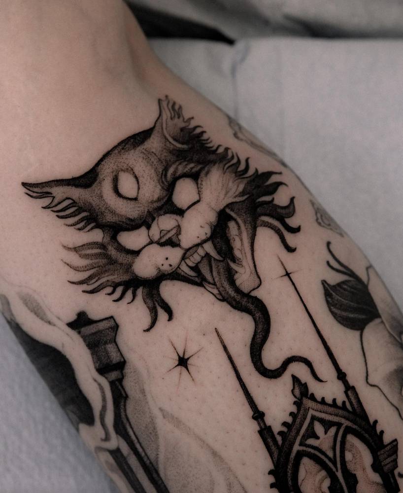 Evil cat portrait tattoo done on the calf.