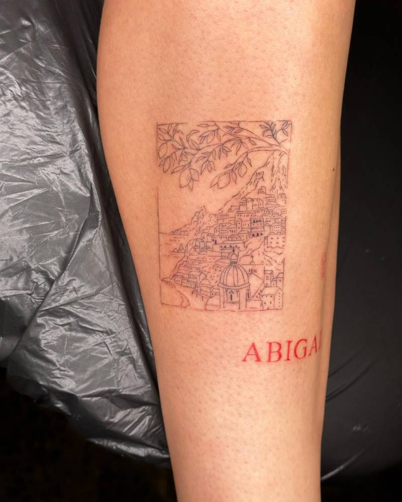 Amalfi Coast tattoo located on the shin, fine line style.