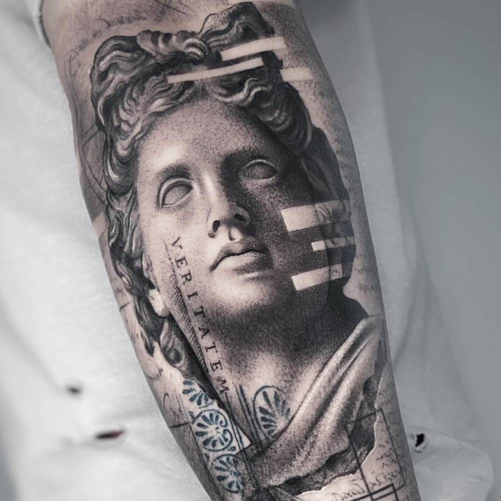Apollo Belvedere tattoo located on the inner forearm.