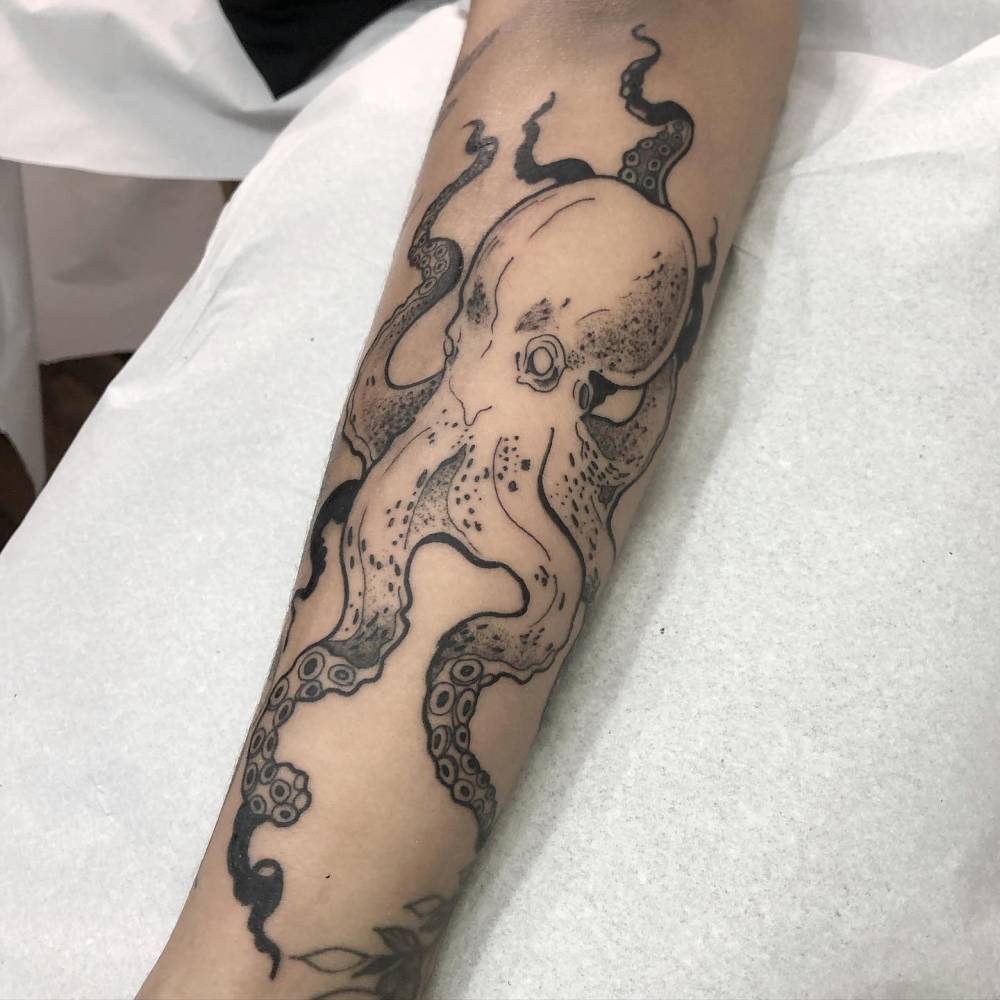 Octopus tattoo done on the forearm, illustrative style.