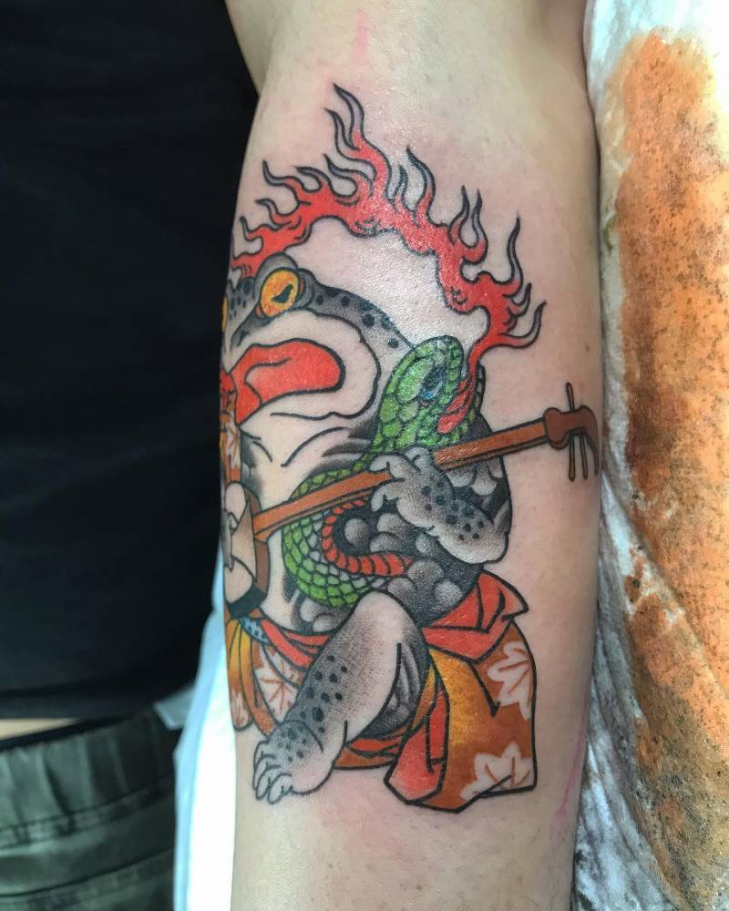 Japanese toad tattoo located on the calf.