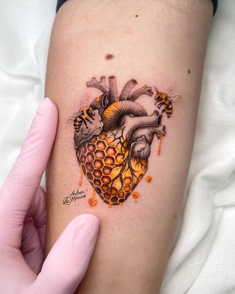 Honeycomb heart tattoo located on the inner forearm, illustrative style.