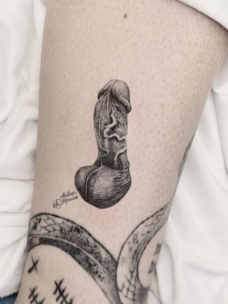 Penis tattoo in micro-realism located on the shin.