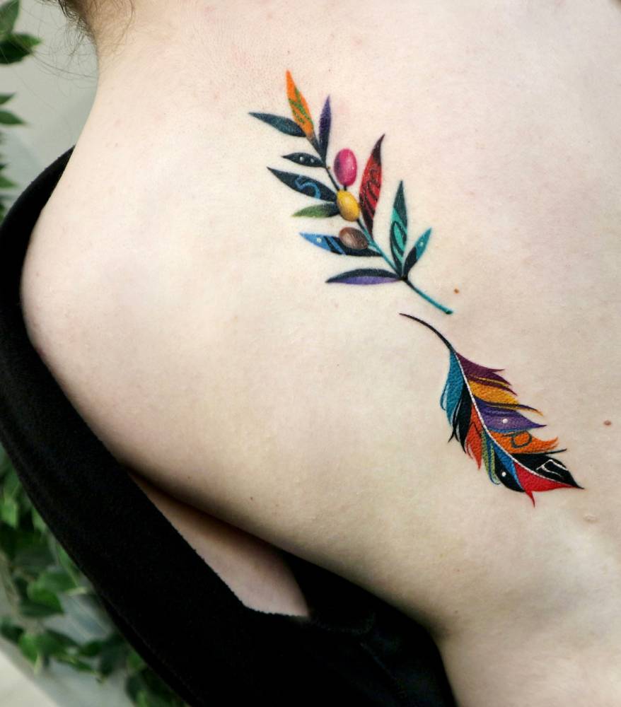 Olive branch and feather tattoos located on the spine, pop art style.