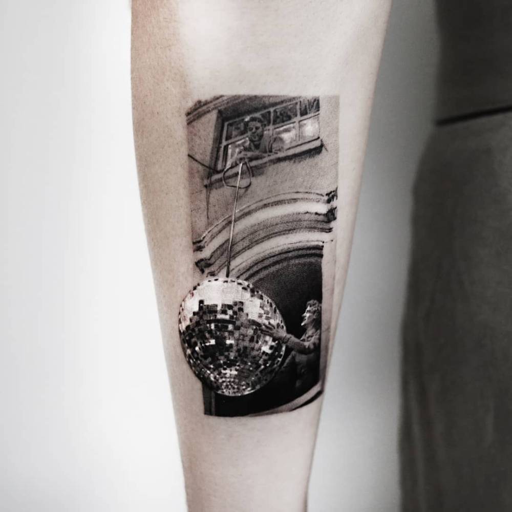 Disco ball tattoo in micro-realism located on the inner forearm.