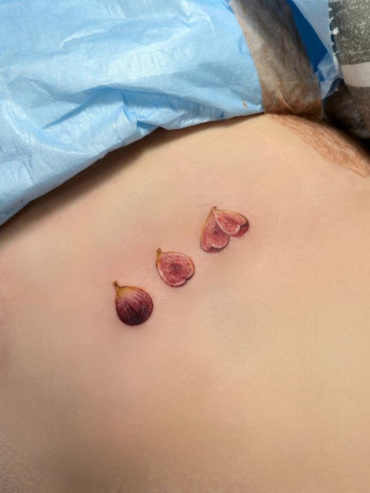 Figs tattoo located on the rib, done in micro-realism.