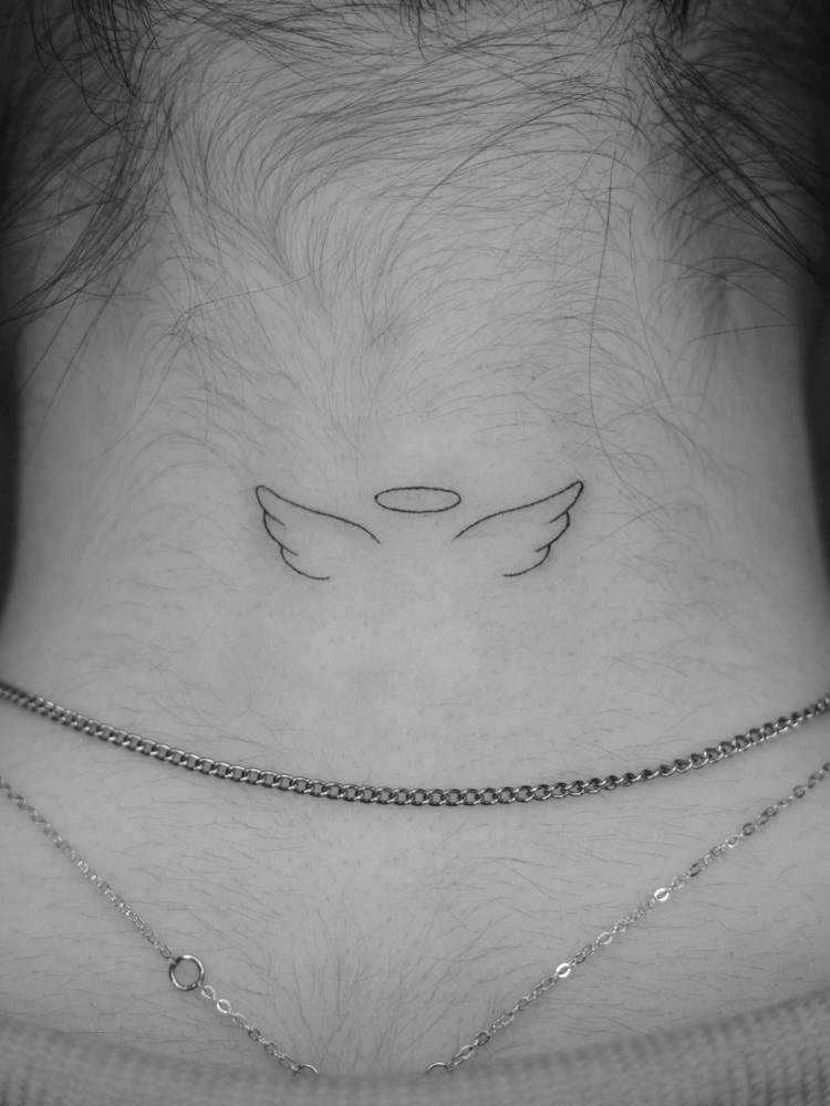 Angel wings and halo tattoo in minimalistic style done on the back of the neck.