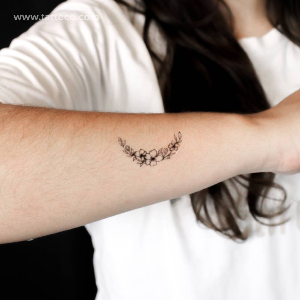 Flower moon semi-permanent tattoo located on the wrist.