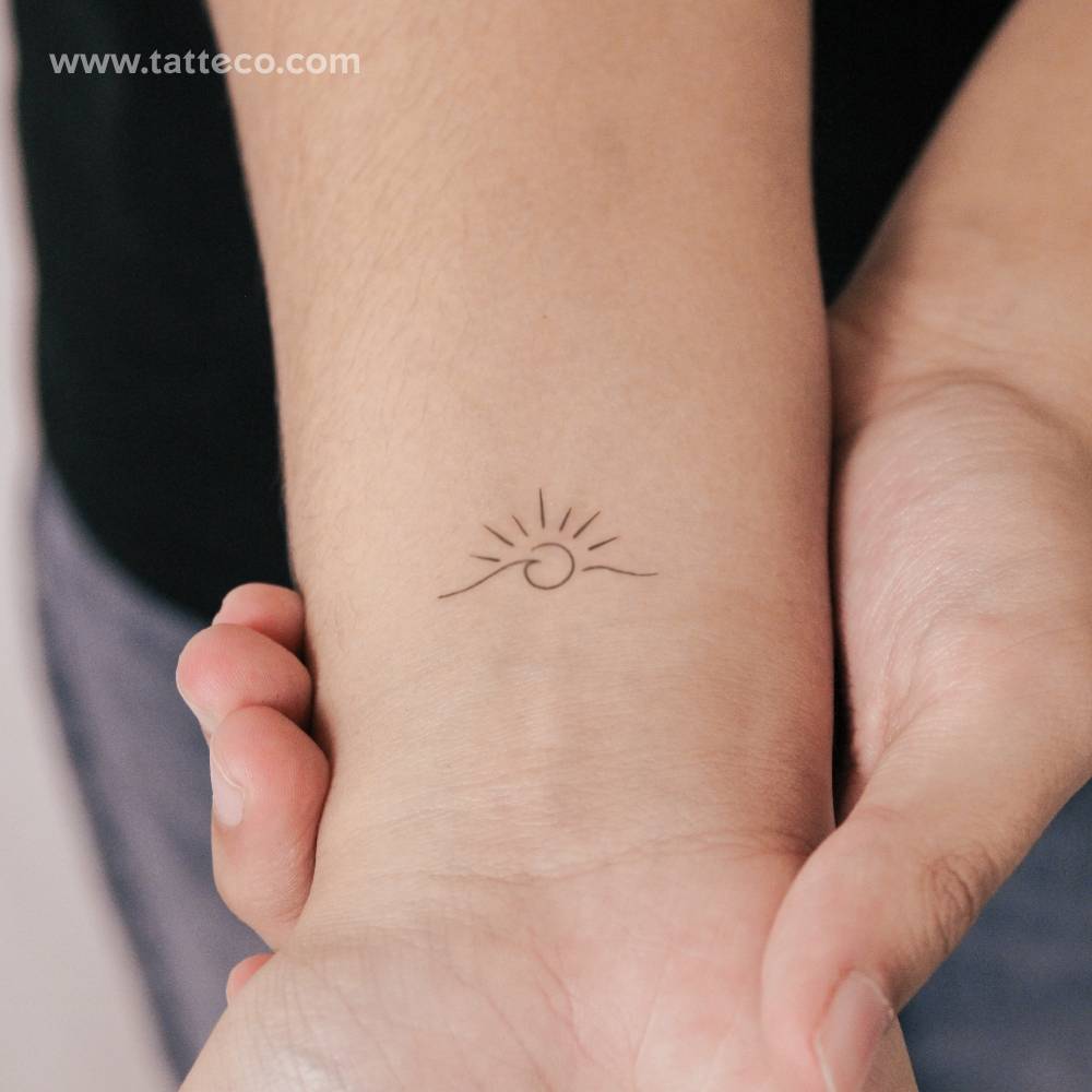 Small minimalistic wave sunset semi-permanent tattoo.