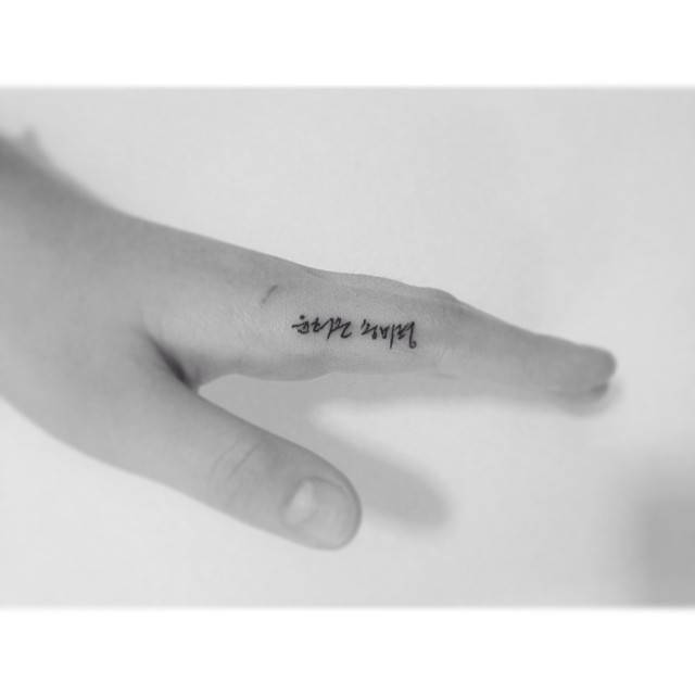Korean lettering tattoo located on the finger.