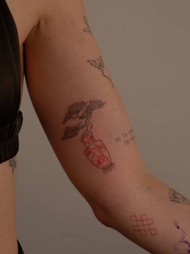 Bonsai tattoo in fine line style located on the inner arm.