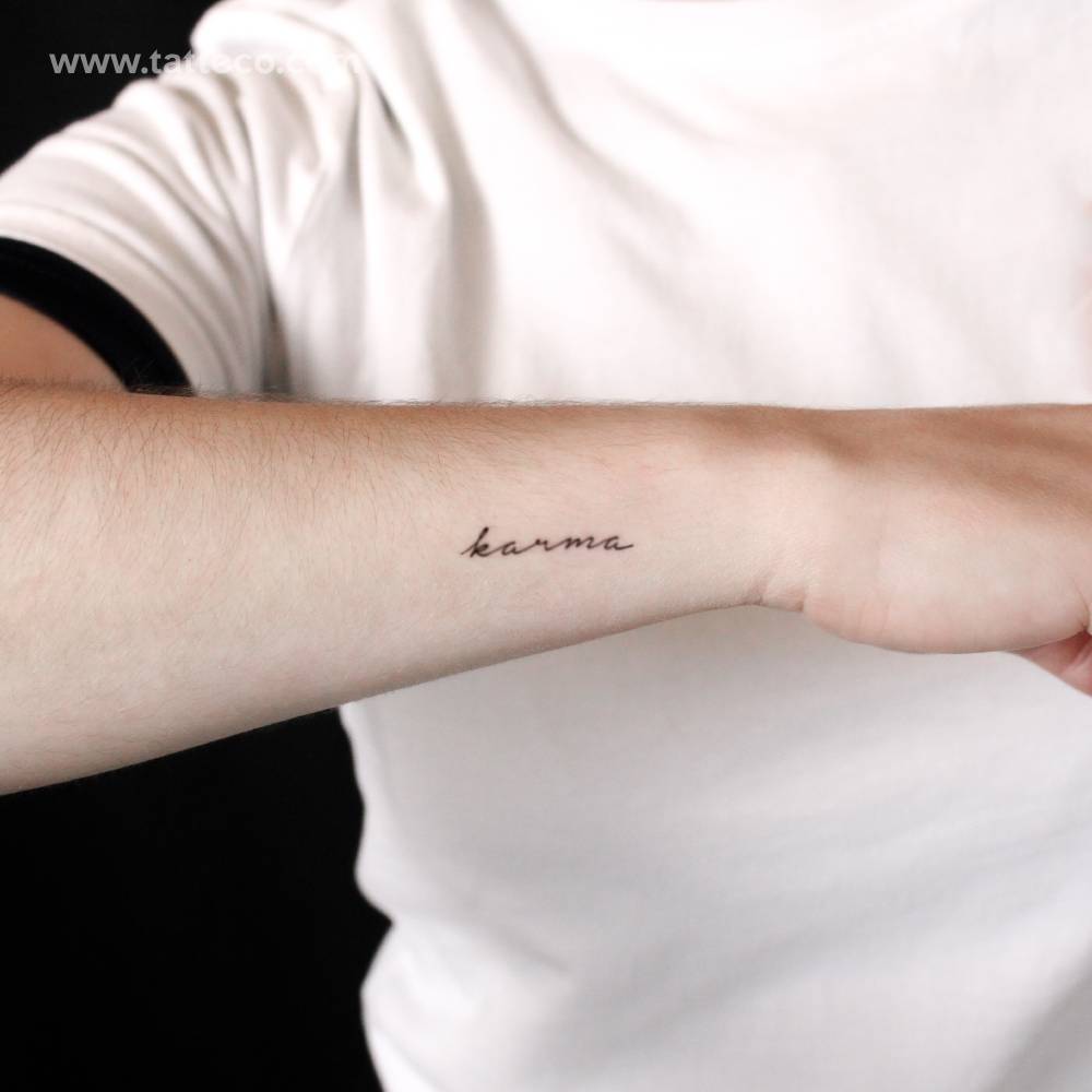 Karma semi-permanent tattoo located on the wrist.