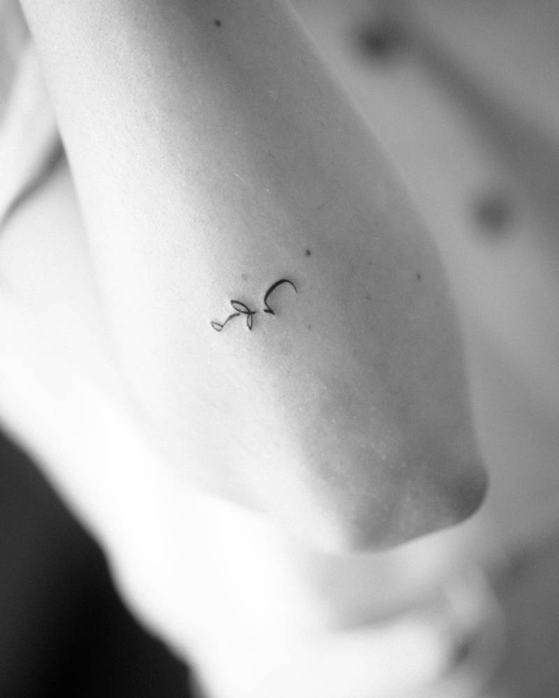 Persian lettering tattoo located on the forearm.