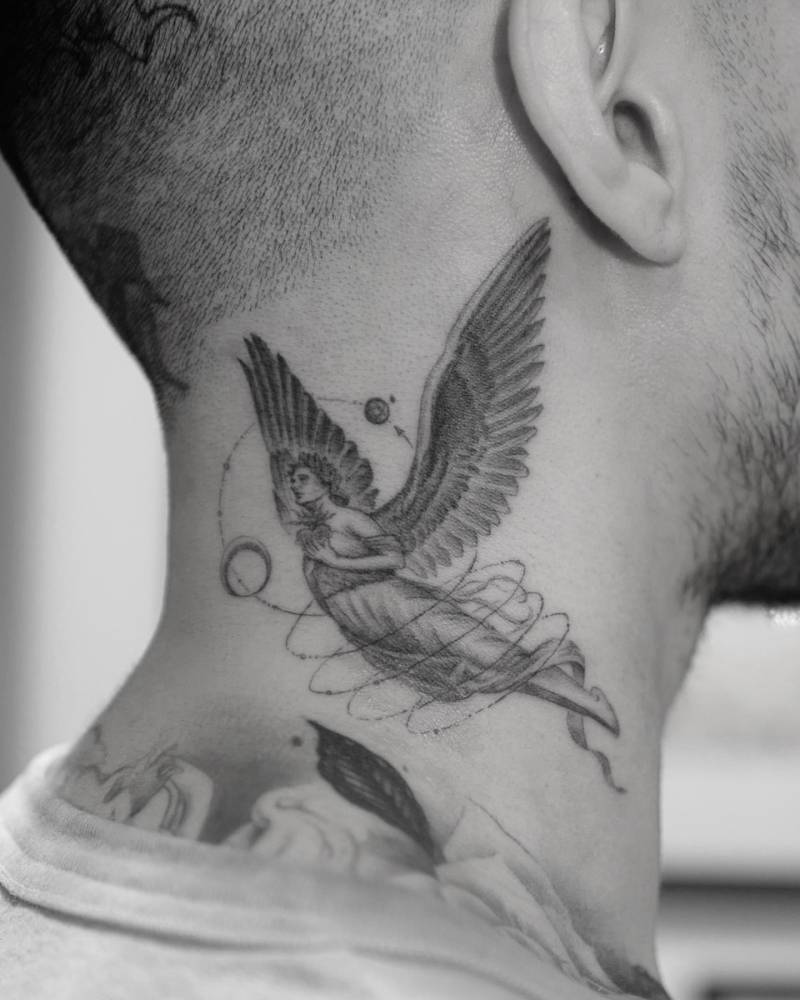 Single needle angel tattoo located on the neck.