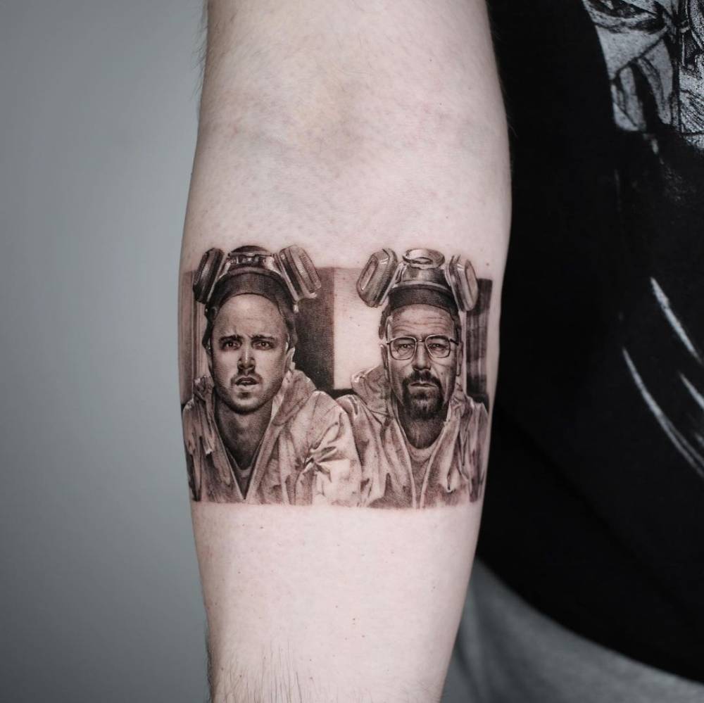 Micro-realistic Breaking Bad tattoo on the inner forearm.