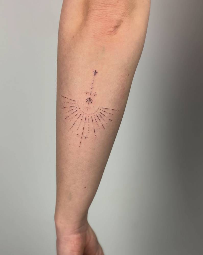Ornamental tattoo in fine line style located on the forearm.