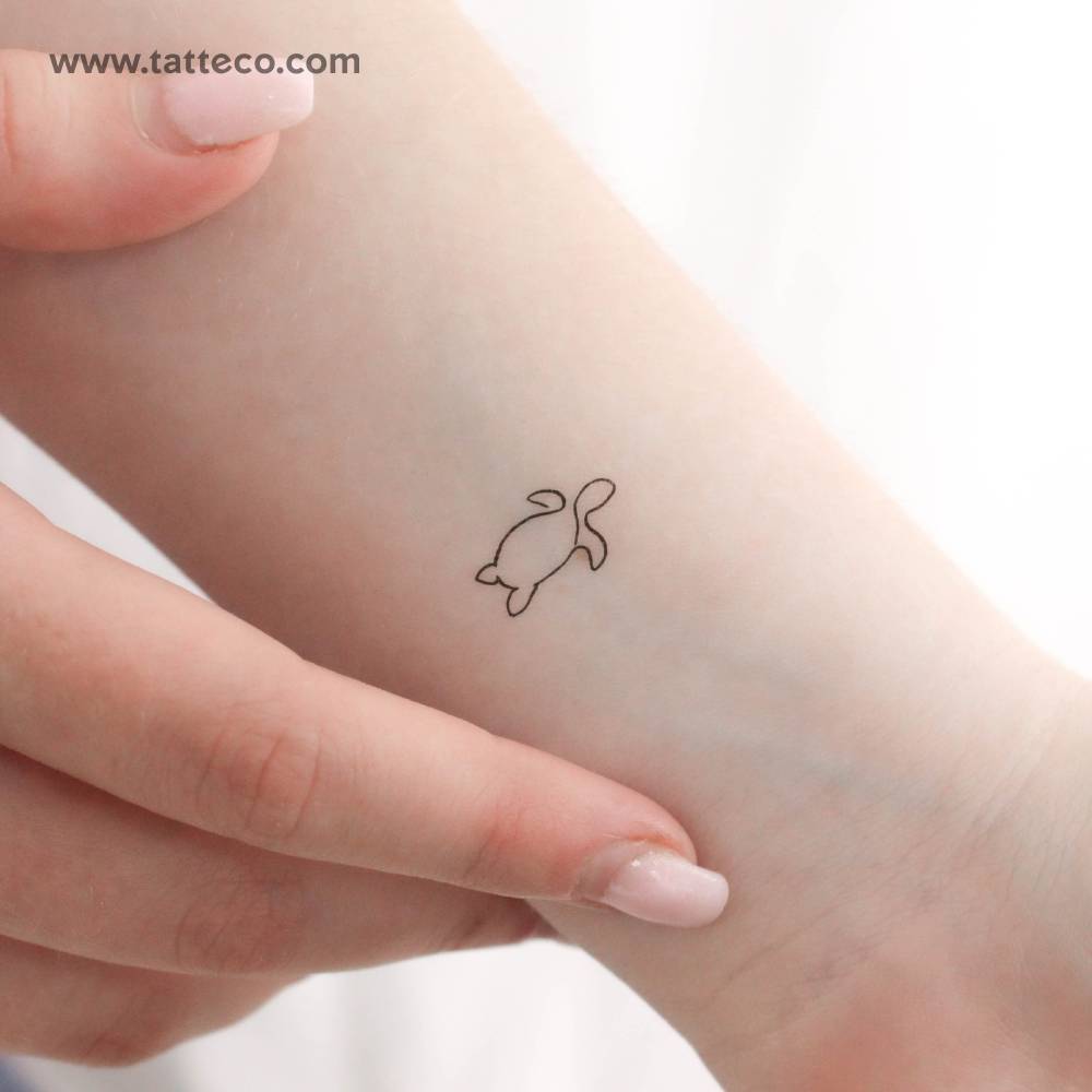 Single line turtle temporary tattoo located on the wrist.