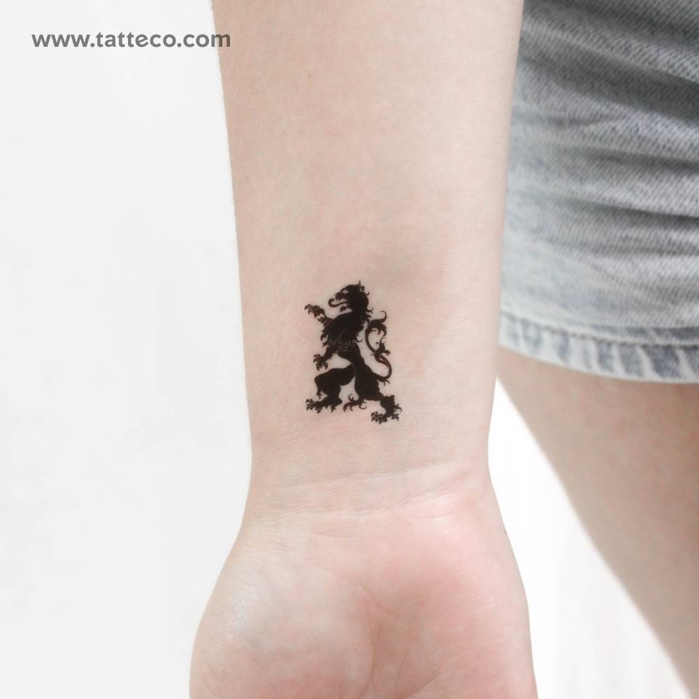 Ornamental lion temporary tattoo located on the wrist.